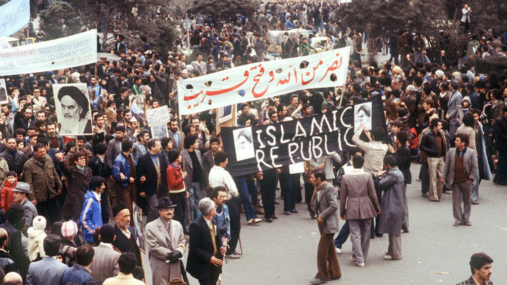 Iran-israel conflict: A Deep Dive into Regional Tensions Protesters during the 1979 Islamic Revolution in Iran, marking the overthrow of the Shah and the beginning of Iran’s ideological shift against Israel.