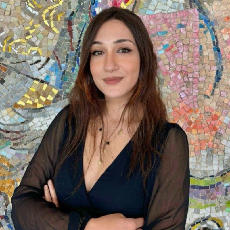 A professional headshot of Aya Ouiremmi, Research Associate at Hegemoniq.