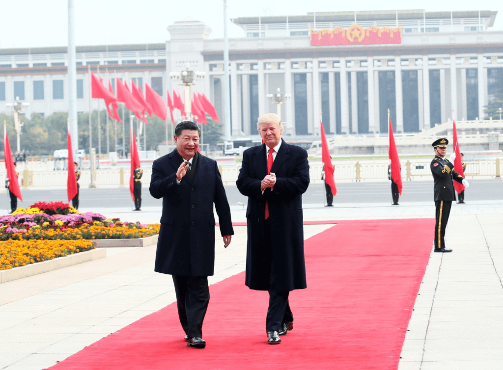 Between Principle and Pressure: India’s Strategic Autonomy in the age of G2 Competition and Tariff Diplomacy US President Donald Trump and Chinese President Xi Jinping walking together on a red carpet in front of the Great Hall of the People in Beijing during a state visit.