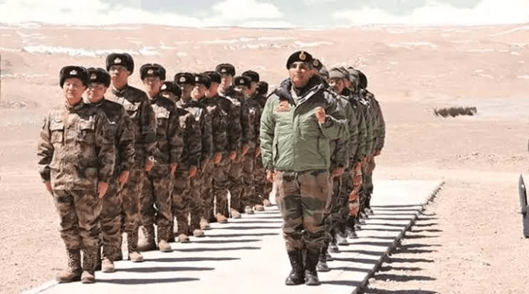 Military commanders from India and China standing face-to-face in winter gear during high-altitude border disengagement talks along the Line of Actual Control.